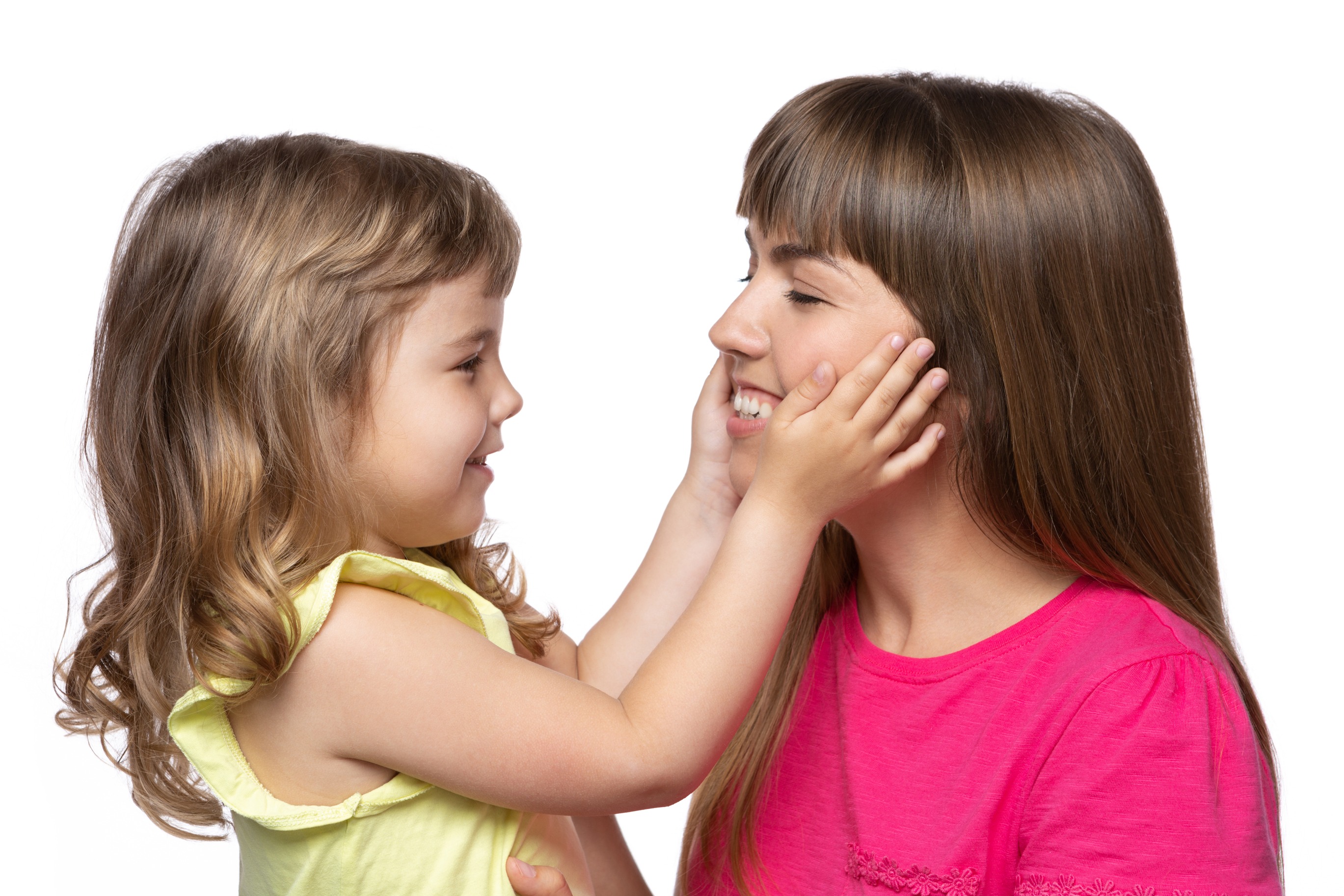 A loving mother and daughter sharing a tender moment, with the child gently touching her mother's face